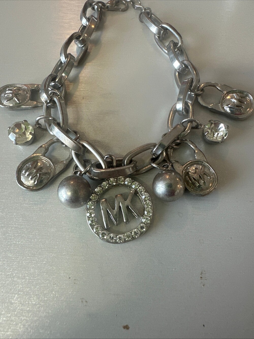 Michael Kors Silver Charm Bracelet with MK Logo and Rhinestones